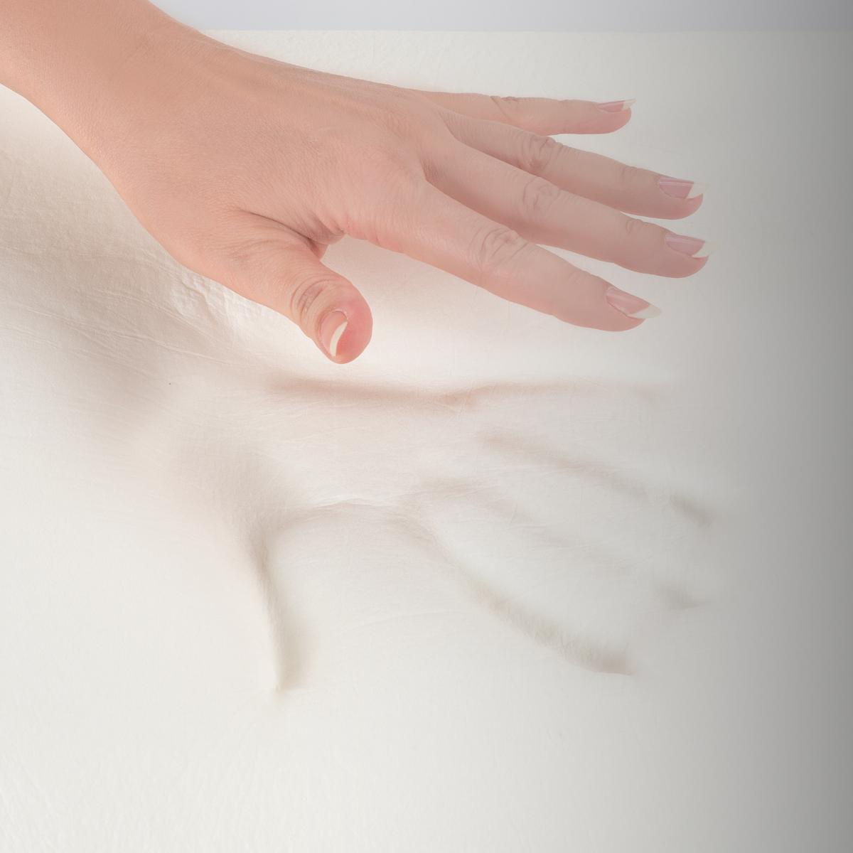 woman-pressing-down-on-mempry-foam-mattress