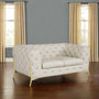 white tufted leather sofa in a natural blue and beige color room