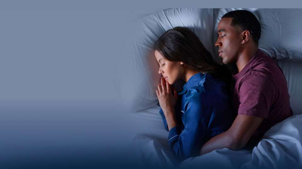  couple-in-bed-with-blue-background