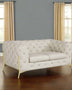 white tufted leather sofa in a natural blue and beige color room