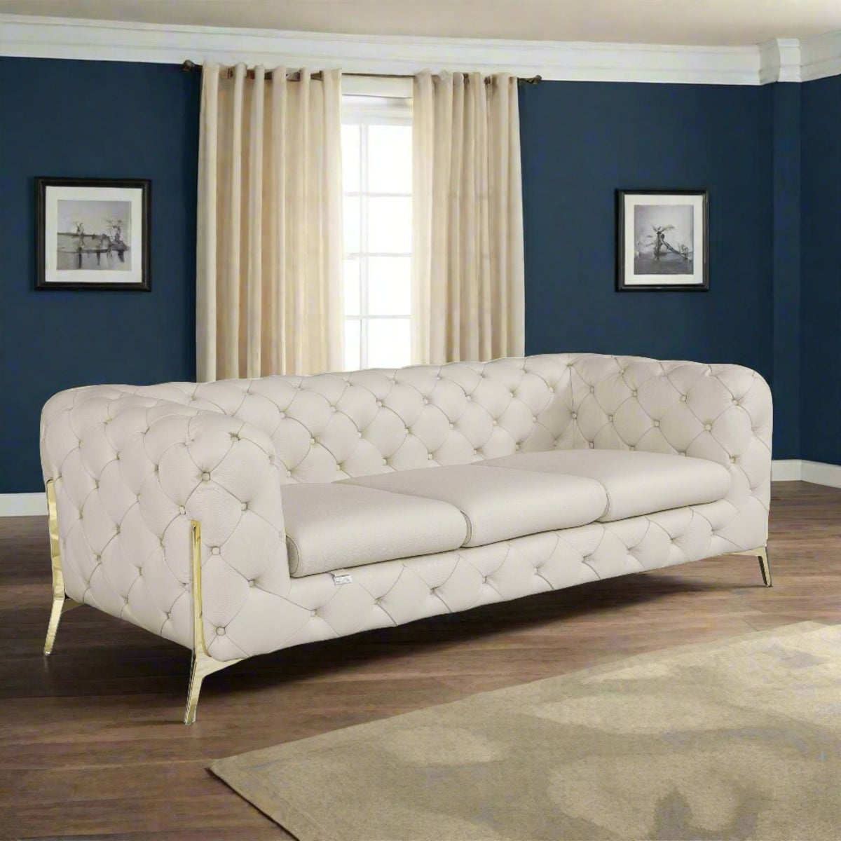 beige-tufted button sofa in a navy blue room