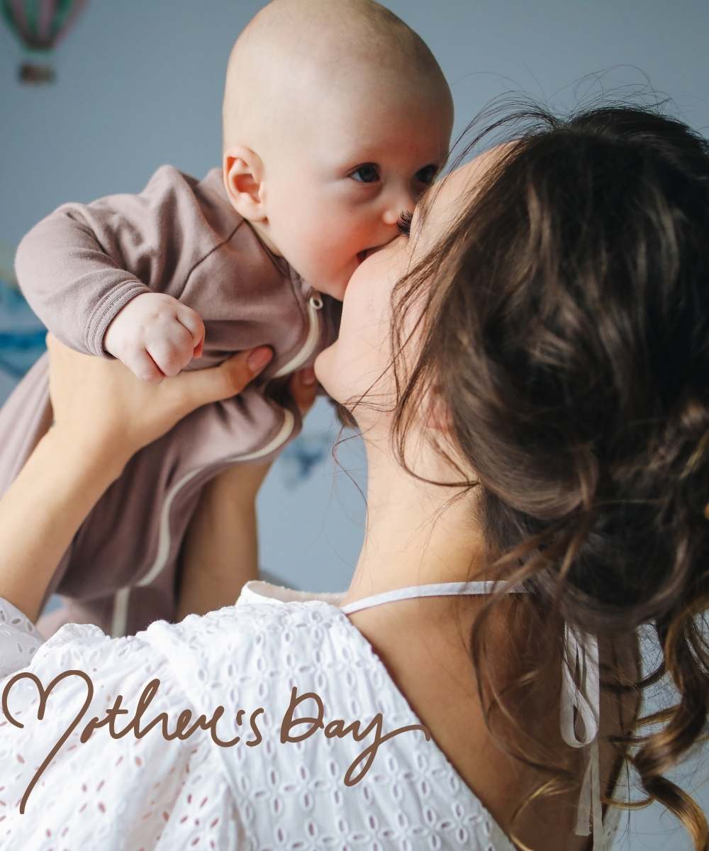 mothers-day-2024-woman-holding-her-baby-kissing-him-sweetly
